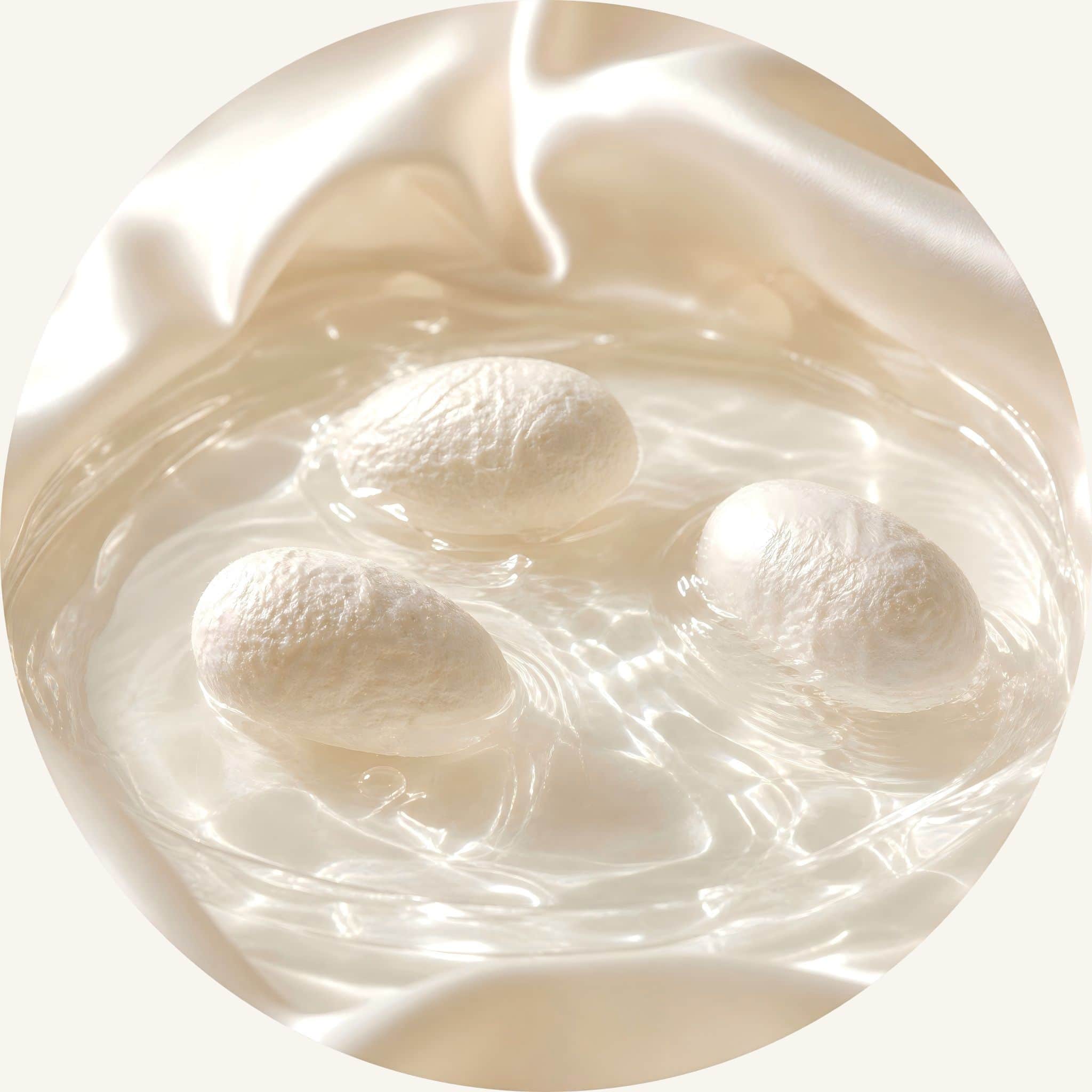Pure organic silk protein cocoons in clean water, serving as a natural cuticle smoother to eliminate frizz and soften hair.